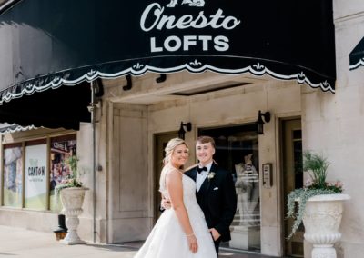 onesto lofts entrance with bride an groom wedding dress train fanned out